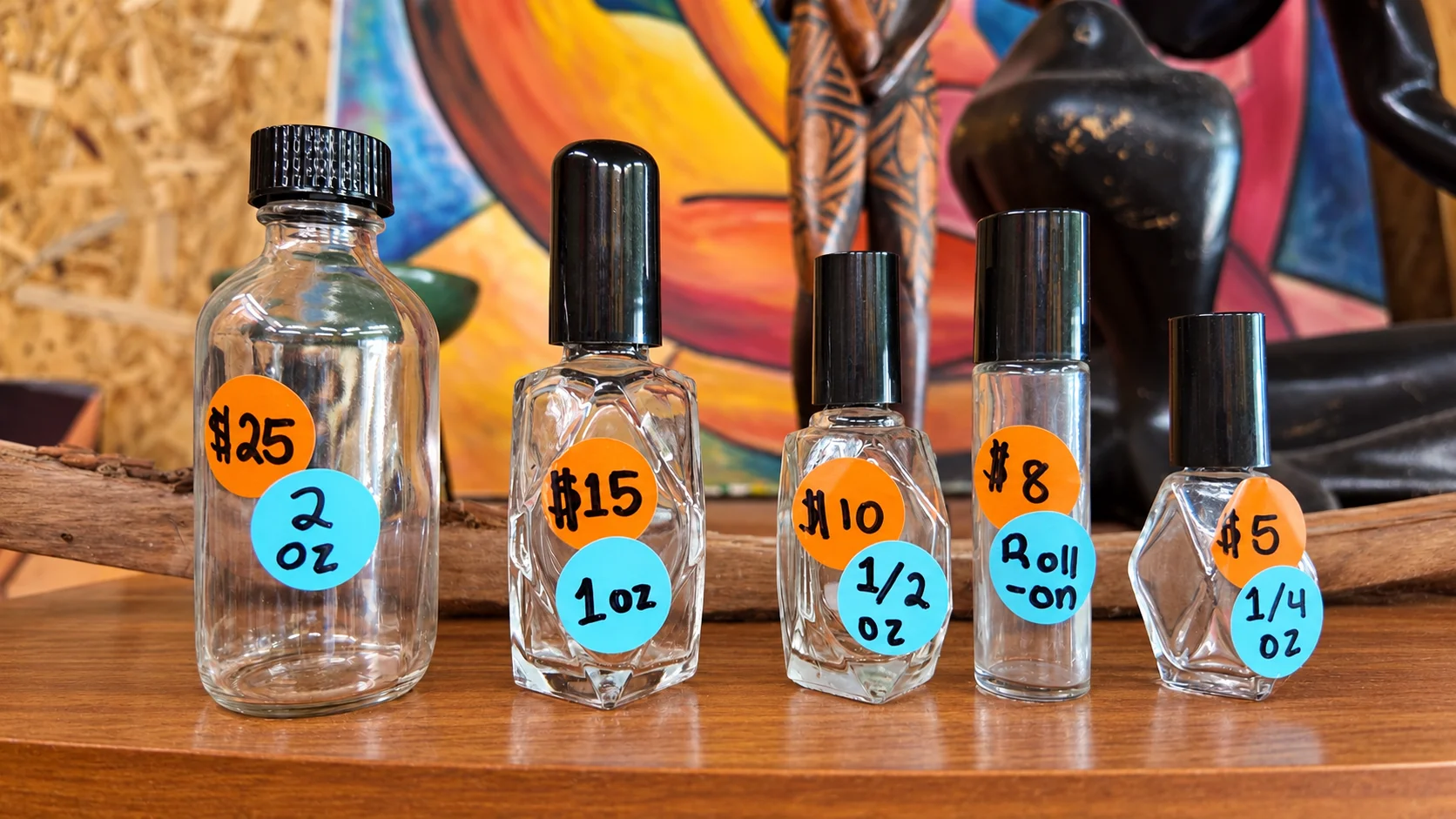 Five sample bottles: 2 oz, 1 oz, half oz, roll-on, and quarter oz