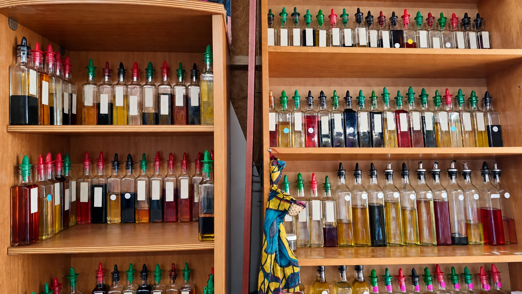 Scented oils in glass bottles on the wooden shelves at Alkebu-Lan Images